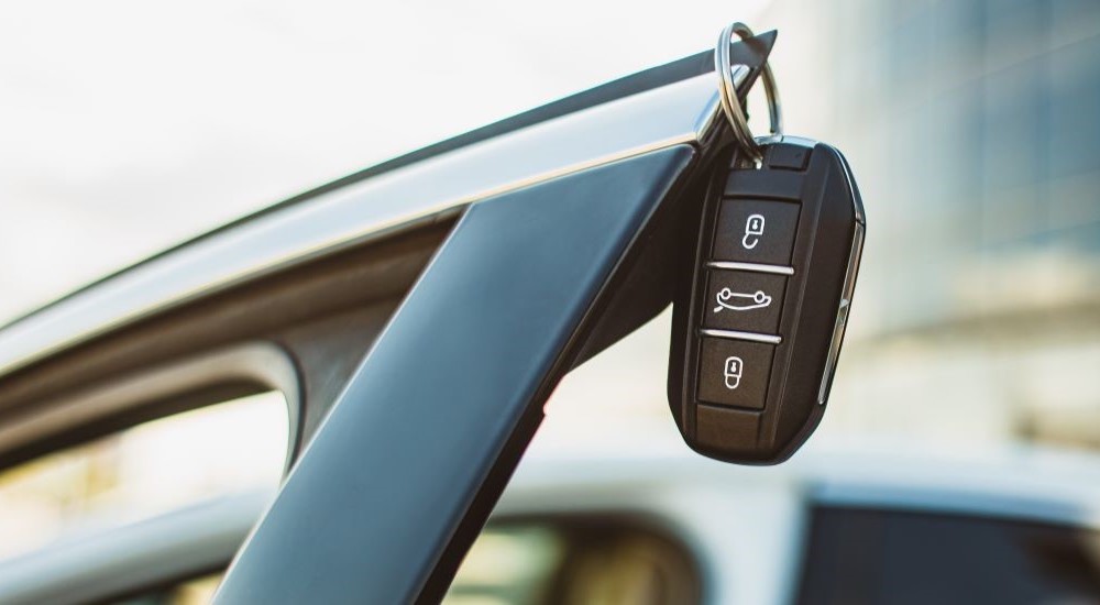 A key fob hanging from the door of one of the most popular Certified Pre-Owned cars.