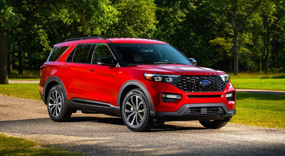 A red 2022 Ford Explorer ST-Line is shown from the front at an angle.