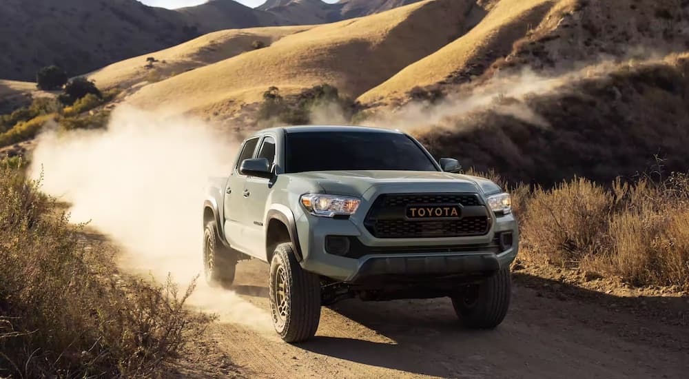 A grey 2022 Toyota Tacoma is shown from the front at an angle.
