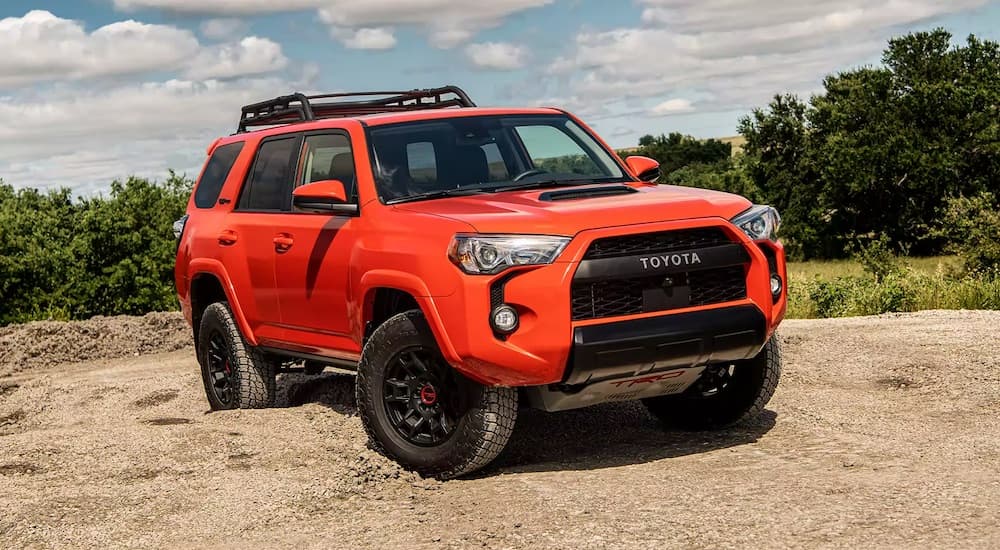 An orange 2023 Toyota 4Runner TRD Pro is shown from the front at an angle after leaving a dealer that has used SUVs for sale near Mooresville.