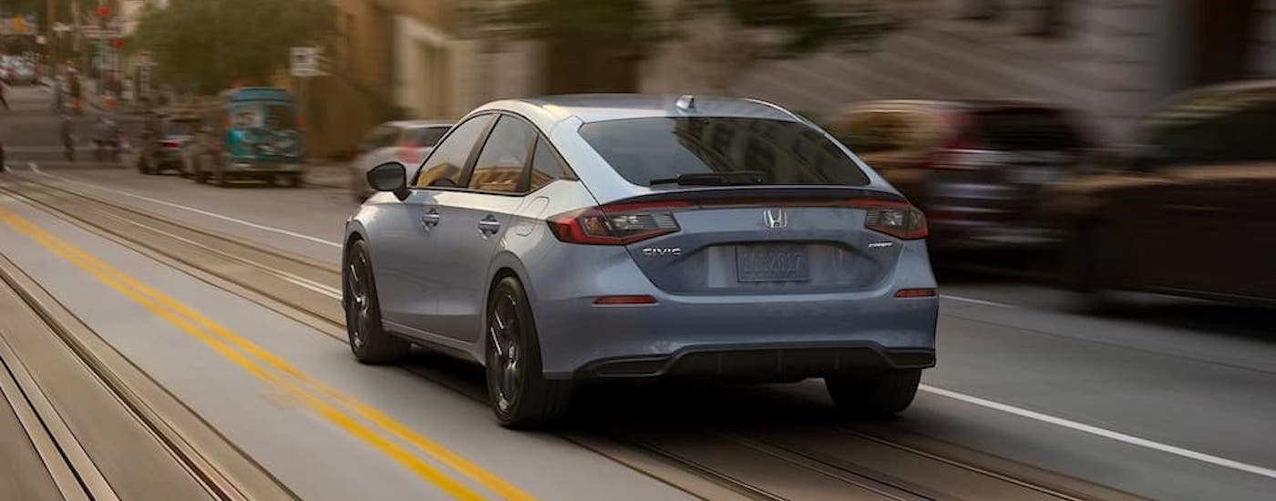 A grey 2022 Honda Civic Hatchback is shown from the rear at an angle after leaving a dealer that has used cars for sale near Martinsville.