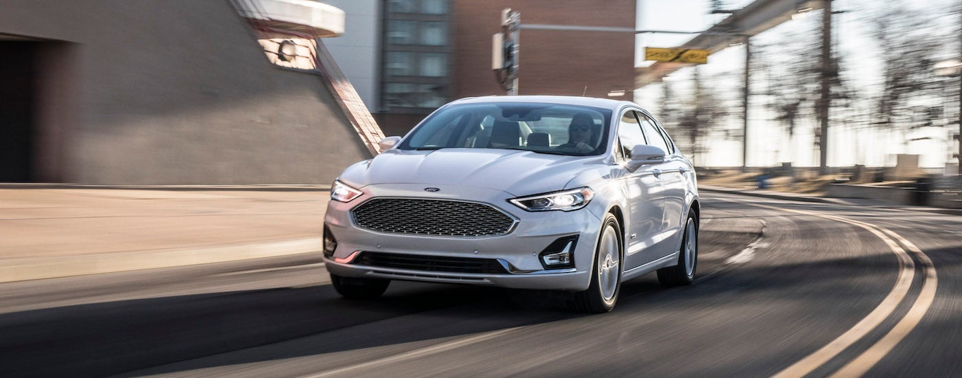 A white 2020 Ford Fusion is shown from the front at an angle after leaving a used car dealer near Franklin, In.