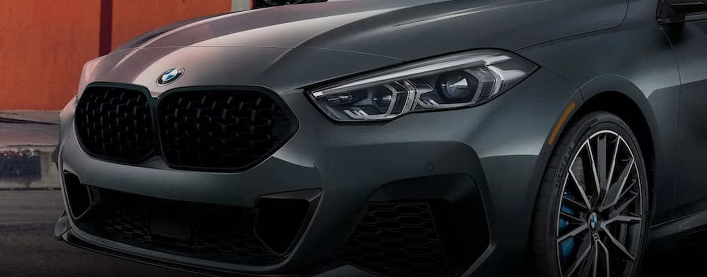 A close up of the hood on a grey 2022 BMW 2 Series is shown at a used car dealer near Fishers.